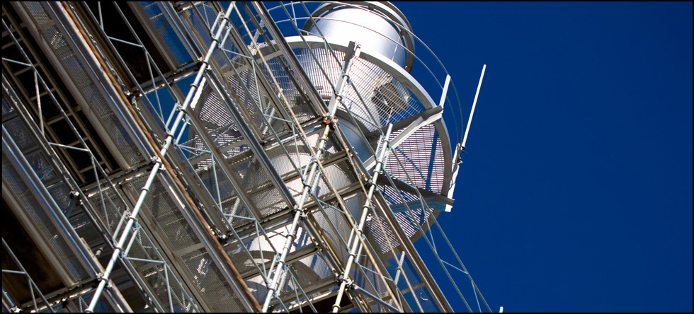 Department of the Navy: Structural and electrical repairs and surface preparation/repainting of eight smoke stacks at Building P-1.