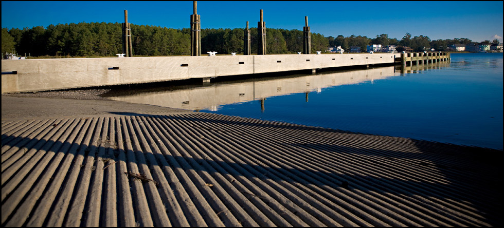 Department of the Navy: Demolition of two existing timber piers by extraction (vibration) and construction of a new concrete pier