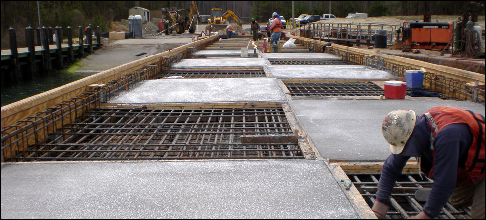 Department of the Navy: Demolition of two existing timber piers by extraction (vibration) and construction of a new concrete pier