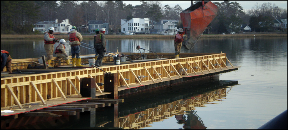 Department of the Navy: Demolition of two existing timber piers by extraction (vibration) and construction of a new concrete pier