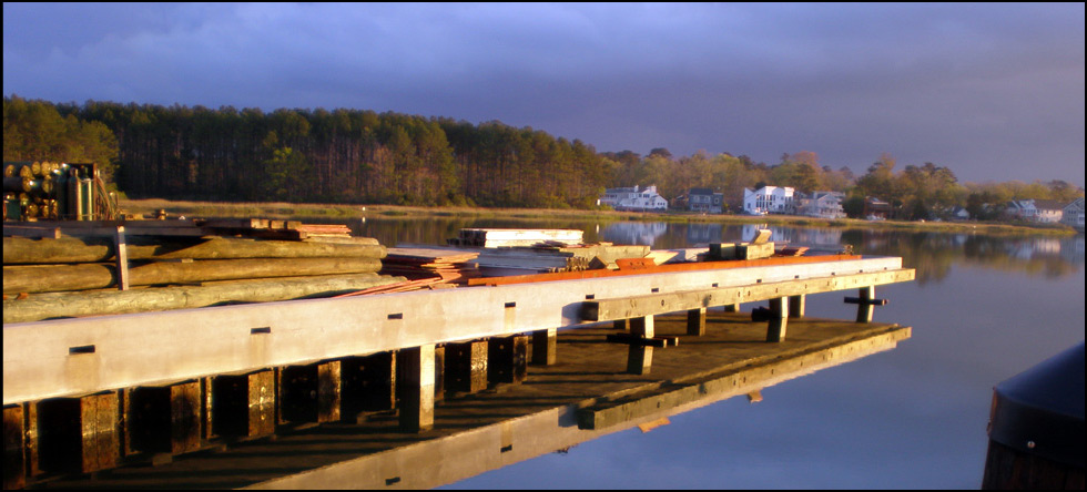 Department of the Navy: Demolition of two existing timber piers by extraction (vibration) and construction of a new concrete pier